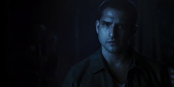 Movie still from “Teen Wolf: The Movie” (2023), directed by Russell Mulcahy – A person in a dark room; Close Up shot, Low angle