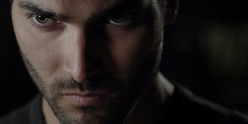 Movie still from “Teen Wolf: The Movie” (2023), directed by Russell Mulcahy – A man's face in the dark; Close Up shot, Low angle