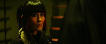 Movie still from “Teenage Mutant Ninja Turtles” (2014), directed by Jonathan Liebesman – A person wearing a black jacket; Close Up shot, Over the shoulder angle