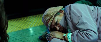Movie still from “Teenage Mutant Ninja Turtles” (2014), directed by Jonathan Liebesman – An older man laying on the ground with his head on the ground; Close Up shot, High angle