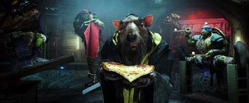 Movie still from “Teenage Mutant Ninja Turtles” (2014), directed by Jonathan Liebesman – A rat holding a piece of pizza in its mouth; Medium shot, Over the shoulder angle