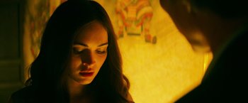 Movie still from “Teenage Mutant Ninja Turtles” (2014), directed by Jonathan Liebesman – A woman with long hair is looking down at her face; Close Up shot, Over the shoulder angle