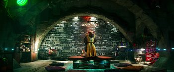 Movie still from “Teenage Mutant Ninja Turtles” (2014), directed by Jonathan Liebesman – Two people standing in front of an array of speakers; Wide shot, Low angle