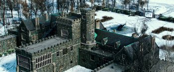 Movie still from “Teenage Mutant Ninja Turtles” (2014), directed by Jonathan Liebesman – An aerial view of an old castle with a tower; Extreme Wide shot, High angle