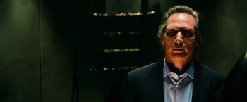 Movie still from “Teenage Mutant Ninja Turtles” (2014), directed by Jonathan Liebesman – A person wearing a suit and tie; Close Up shot, Low angle
