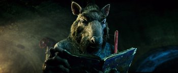 Movie still from “Teenage Mutant Ninja Turtles” (2014), directed by Jonathan Liebesman – An image of an aardvark reading a book; Close Up shot, Low angle