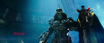 Movie still from “Teenage Mutant Ninja Turtles” (2014), directed by Jonathan Liebesman – A large metal statue of a man in a suit of armor; Medium shot, Low angle