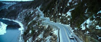 Movie still from “Teenage Mutant Ninja Turtles” (2014), directed by Jonathan Liebesman – A car driving down the side of a mountain road; Extreme Wide shot, High angle