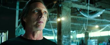 Movie still from “Teenage Mutant Ninja Turtles” (2014), directed by Jonathan Liebesman – A person wearing a black t - shirt; Close Up shot, Low angle