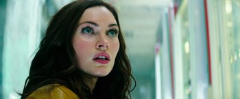 Movie still from “Teenage Mutant Ninja Turtles” (2014), directed by Jonathan Liebesman – A woman's face with long lashes; Close Up shot, Low angle