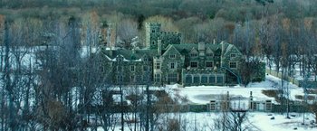 Movie still from “Teenage Mutant Ninja Turtles” (2014), directed by Jonathan Liebesman – A large stone building with a tower on top of it; Extreme Wide shot, High angle