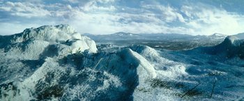 Movie still from “Teenage Mutant Ninja Turtles” (2014), directed by Jonathan Liebesman – A view of a mountain range from the top of a hill; Extreme Wide shot, High angle