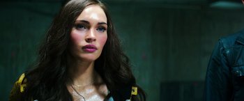 Movie still from “Teenage Mutant Ninja Turtles” (2014), directed by Jonathan Liebesman – A person with long brown hair; Close Up shot, Low angle