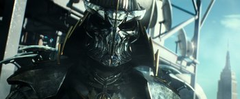 Movie still from “Teenage Mutant Ninja Turtles” (2014), directed by Jonathan Liebesman – The face of an evil looking character; Close Up shot, Low angle