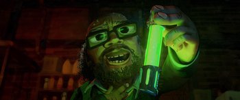 Movie still from “Teenage Mutant Ninja Turtles: Mutant Mayhem” (2023), directed by Jeff Rowe – A person holding a green object; Close Up shot, Low angle
