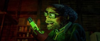 Movie still from “Teenage Mutant Ninja Turtles: Mutant Mayhem” (2023), directed by Jeff Rowe – A man with a beard is holding a cell phone; Close Up shot, Low angle