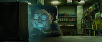 Movie still from “Teenage Mutant Ninja Turtles: Mutant Mayhem” (2023), directed by Jeff Rowe – An animated character is looking at a phone; Medium shot, Low angle