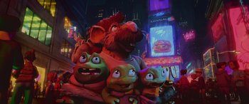 Movie still from “Teenage Mutant Ninja Turtles: Mutant Mayhem” (2023), directed by Jeff Rowe – A group of stuffed animals sitting next to each other in a city; Medium shot, Low angle