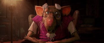 Movie still from “Teenage Mutant Ninja Turtles: Mutant Mayhem” (2023), directed by Jeff Rowe – A rat wearing glasses and wearing a vest; Close Up shot, Over the shoulder angle