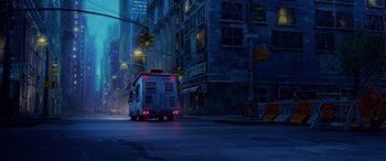 Movie still from “Teenage Mutant Ninja Turtles: Mutant Mayhem” (2023), directed by Jeff Rowe – An ambulance driving down a street at night; Extreme Wide shot, Low angle