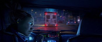 Movie still from “Teenage Mutant Ninja Turtles: Mutant Mayhem” (2023), directed by Jeff Rowe – A view from a car looking at a street scene at night; Wide shot, Low angle