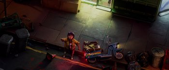 Movie still from “Teenage Mutant Ninja Turtles: Mutant Mayhem” (2023), directed by Jeff Rowe – A little girl standing next to a scooter on the ground; Extreme Wide shot, Overhead angle