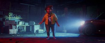 Movie still from “Teenage Mutant Ninja Turtles: Mutant Mayhem” (2023), directed by Jeff Rowe – An animated character is standing in the dark; Wide shot, Low angle