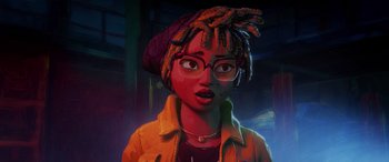 Movie still from “Teenage Mutant Ninja Turtles: Mutant Mayhem” (2023), directed by Jeff Rowe – An animated woman wearing glasses and a hat; Close Up shot, Low angle