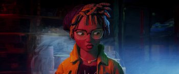 Movie still from “Teenage Mutant Ninja Turtles: Mutant Mayhem” (2023), directed by Jeff Rowe – An animated woman wearing glasses and an orange jacket; Close Up shot, Over the shoulder angle