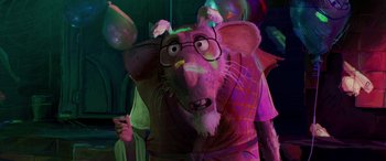 Movie still from “Teenage Mutant Ninja Turtles: Mutant Mayhem” (2023), directed by Jeff Rowe – A rat wearing glasses and holding a cell phone in his mouth; Close Up shot, Over the shoulder angle