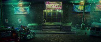 Movie still from “Teenage Mutant Ninja Turtles: Mutant Mayhem” (2023), directed by Jeff Rowe – An image of an outside of a bar in the dark; Extreme Wide shot, Low angle