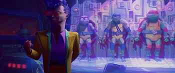 Movie still from “Teenage Mutant Ninja Turtles: Mutant Mayhem” (2023), directed by Jeff Rowe – A group of teenage mutant ninja turtles standing next to each other; Wide shot, Low angle