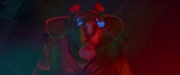 Movie still from “Teenage Mutant Ninja Turtles: Mutant Mayhem” (2023), directed by Jeff Rowe – A painting of a man with glasses on; Close Up shot, High angle