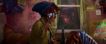 Movie still from “Teenage Mutant Ninja Turtles: Mutant Mayhem” (2023), directed by Jeff Rowe – A person with a hat and a cell phone in their hand; Medium shot, High angle