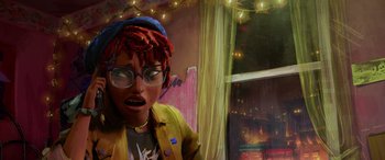 Movie still from “Teenage Mutant Ninja Turtles: Mutant Mayhem” (2023), directed by Jeff Rowe – A woman with a red dreadlocks wearing glasses and a yellow jacket; Close Up shot, Low angle