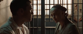 Movie still from “Terminator Salvation” (2009), directed by McG – A man and a woman standing next to each other in front of a jail cell; Close Up shot, Over the shoulder angle