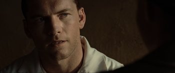 Movie still from “Terminator Salvation” (2009), directed by McG – A person wearing a white shirt; Close Up shot, Low angle