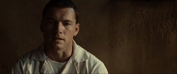 Movie still from “Terminator Salvation” (2009), directed by McG – A person wearing a white shirt; Close Up shot, Over the shoulder angle