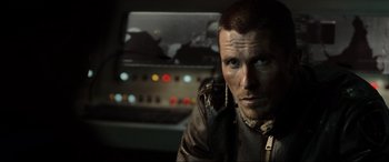 Movie still from “Terminator Salvation” (2009), directed by McG – A person wearing a leather jacket; Close Up shot, Over the shoulder angle