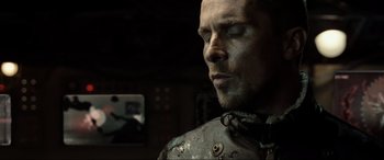 Movie still from “Terminator Salvation” (2009), directed by McG – A person wearing a helmet; Close Up shot, Over the shoulder angle