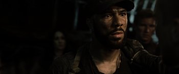 Movie still from “Terminator Salvation” (2009), directed by McG – A person wearing a hat; Close Up shot, Over the shoulder angle