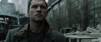 Movie still from “Terminator Salvation” (2009), directed by McG – A person wearing a jacket; Close Up shot, Low angle