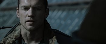 Movie still from “Terminator Salvation” (2009), directed by McG – A person wearing a jacket; Close Up shot, Over the shoulder angle