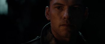 Movie still from “Terminator Salvation” (2009), directed by McG – A man's face in the dark; Close Up shot, Low angle