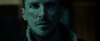 Movie still from “Terminator Salvation” (2009), directed by McG – A man's face in the dark; Close Up shot, Low angle