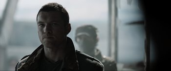 Movie still from “Terminator Salvation” (2009), directed by McG – A person wearing a jacket; Close Up shot, Over the shoulder angle