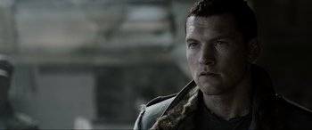 Movie still from “Terminator Salvation” (2009), directed by McG – A person wearing a jacket; Close Up shot, Over the shoulder angle