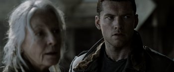 Movie still from “Terminator Salvation” (2009), directed by McG – A man and a woman standing next to each other; Close Up shot, Over the shoulder angle