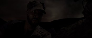 Movie still from “Terminator Salvation” (2009), directed by McG – A man wearing a hat is looking at the camera; Close Up shot, Low angle