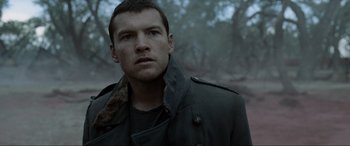 Movie still from “Terminator Salvation” (2009), directed by McG – A person wearing a jacket; Close Up shot, Over the shoulder angle